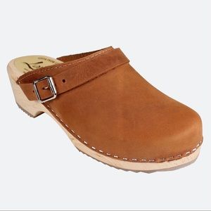 Lotta wooden and leather clogs